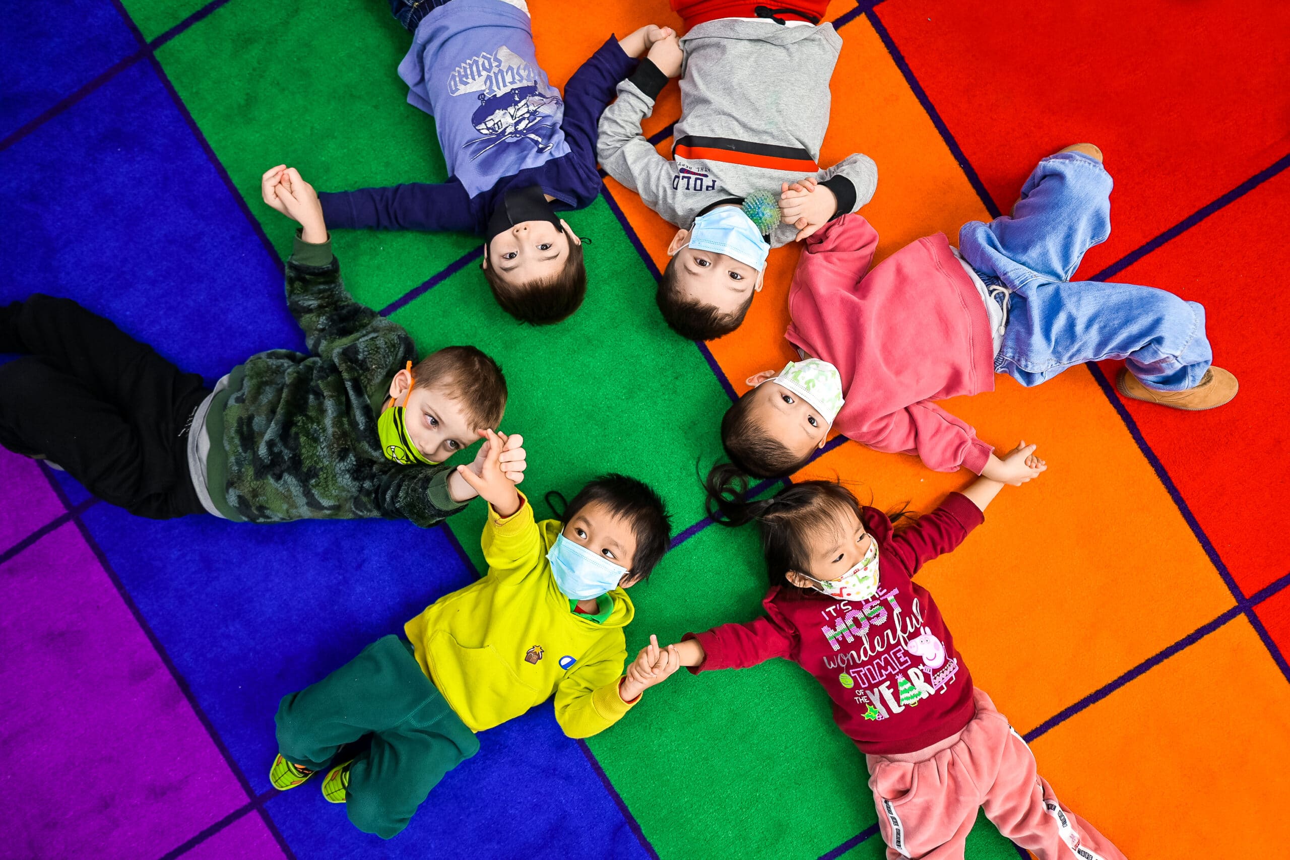 children lying on the mat