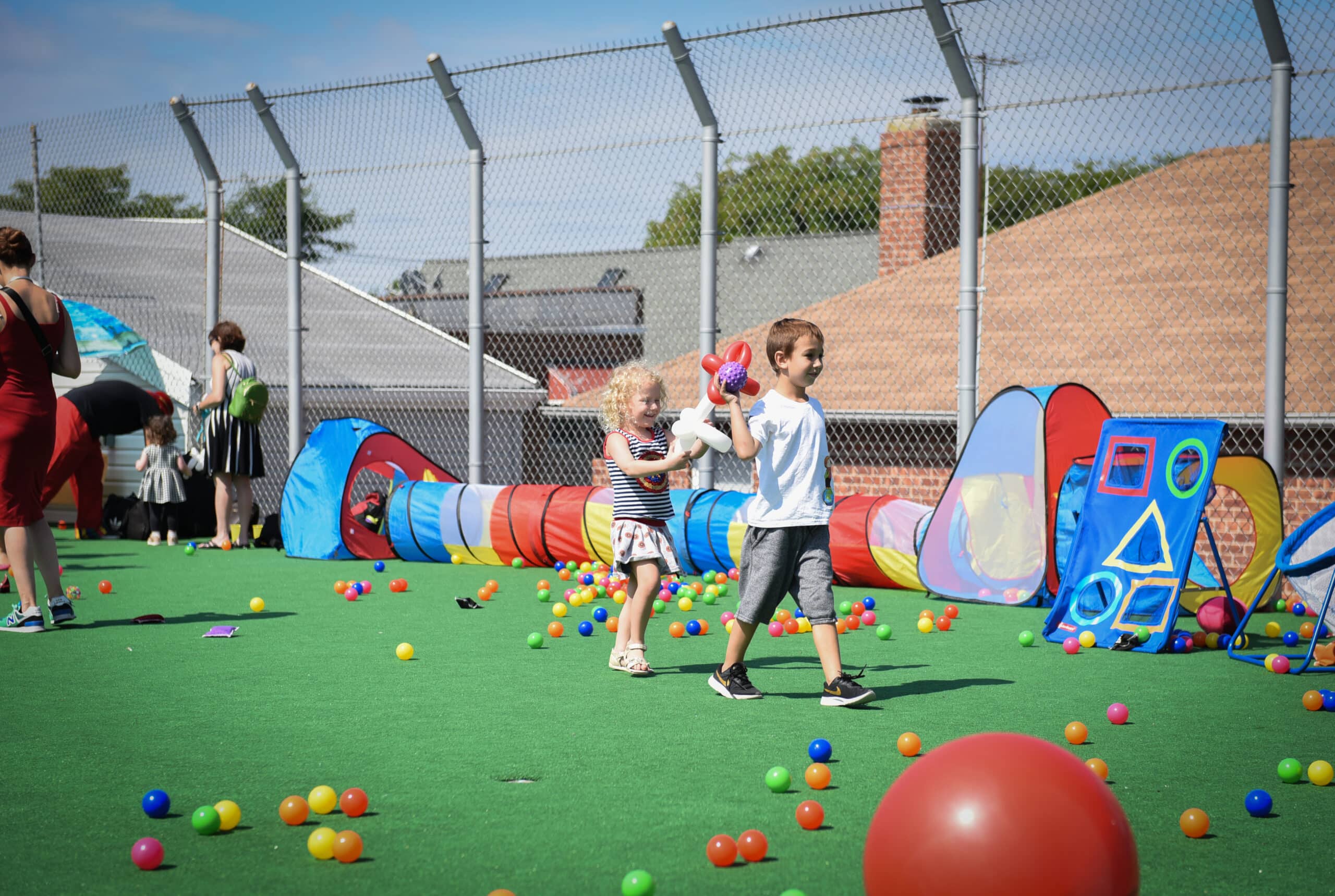 Children playing outside with children's toys