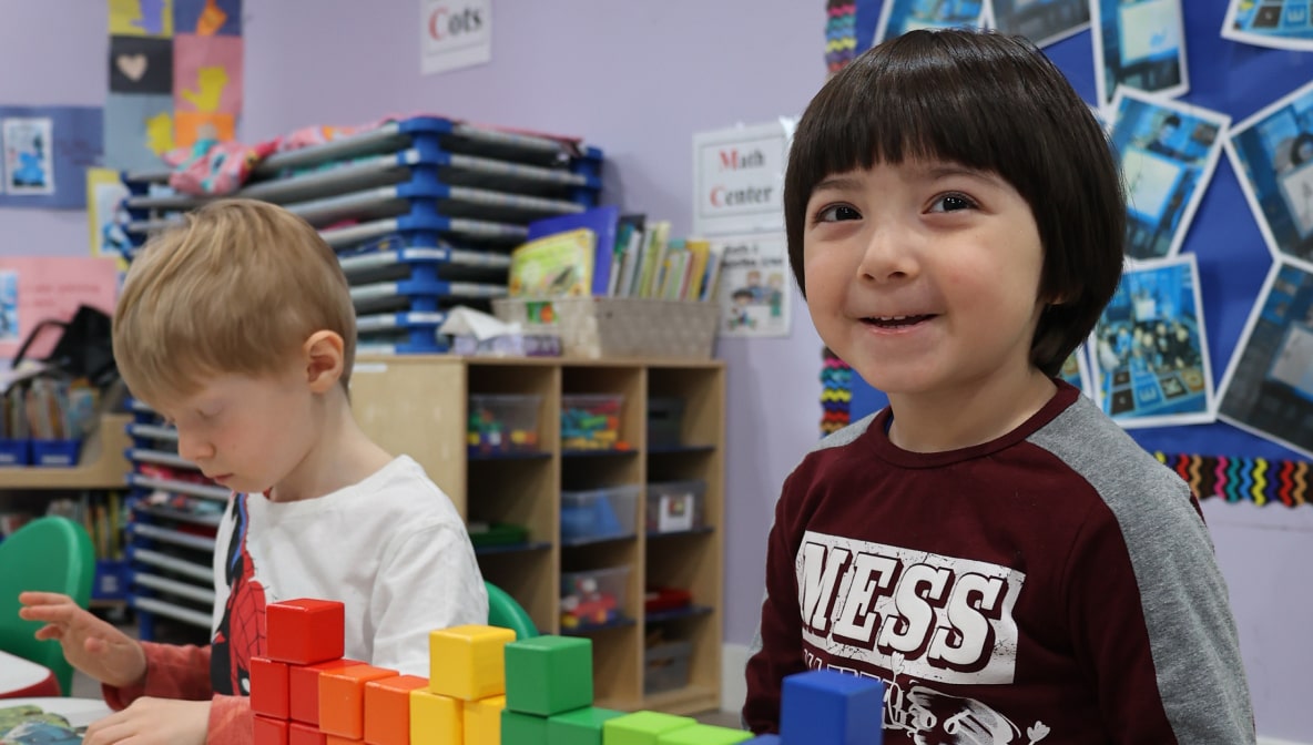 Children engaged with building blocks at Little Scholars Daycare