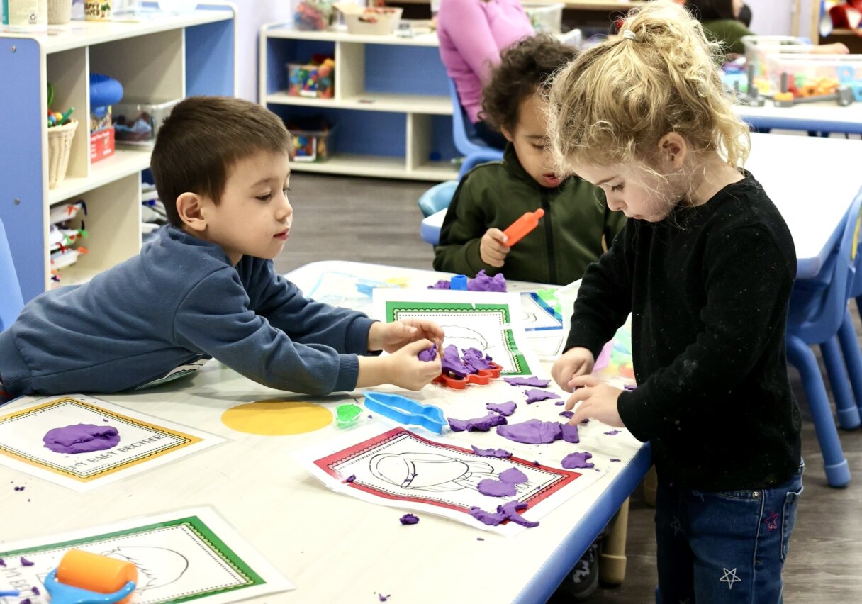 Kids concentrating on learning shapes with eco-friendly activity