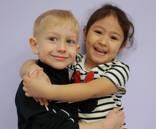 kids-hugging-smiling-daycare