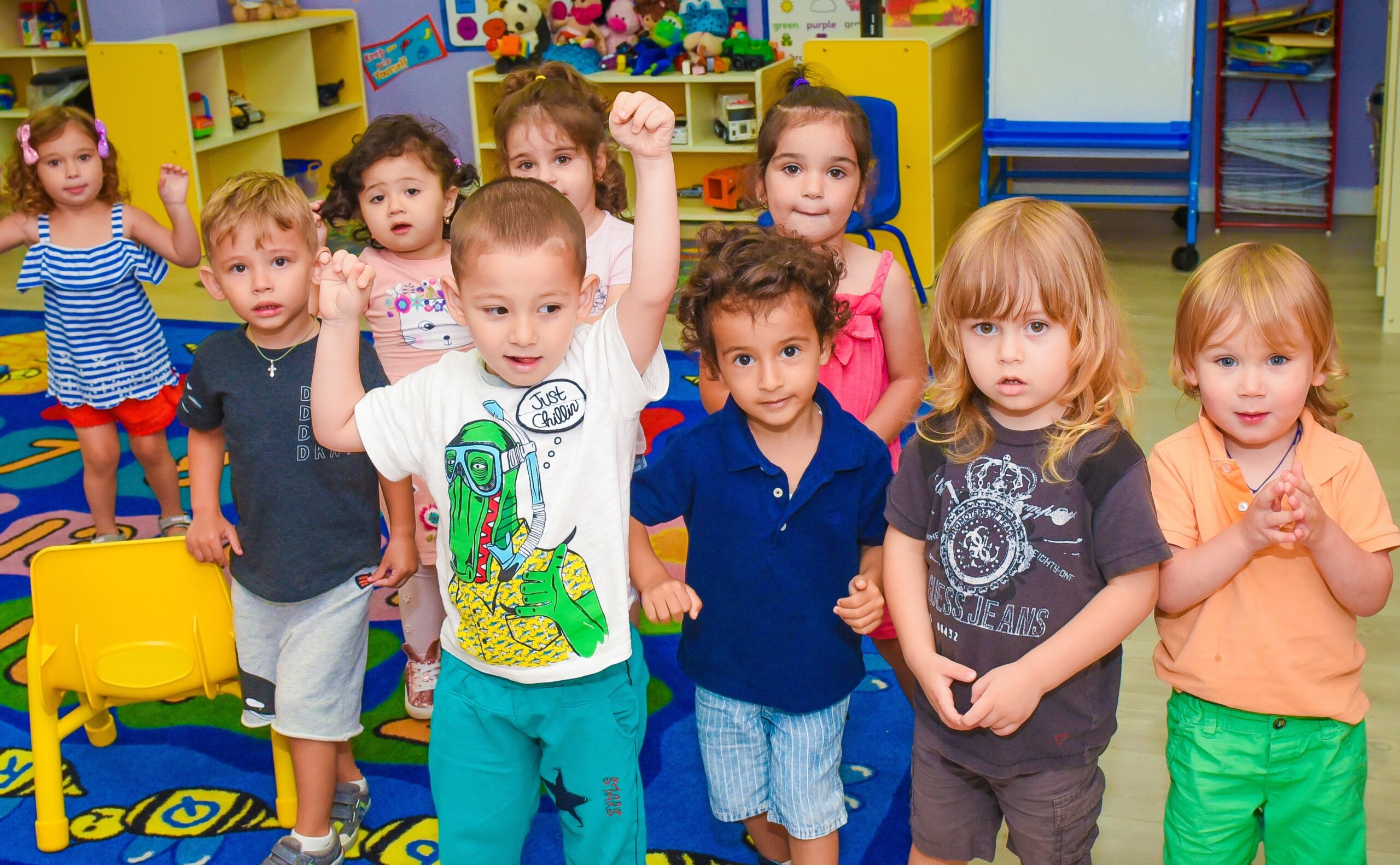 A diverse group of children participating in a social-emotional learning activity at daycare